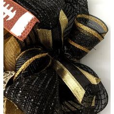 a football themed black and gold mesh wreath