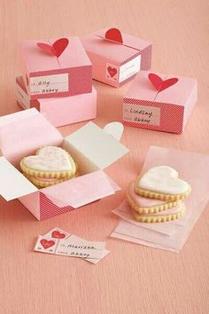 valentine's day cookies in pink boxes with hearts