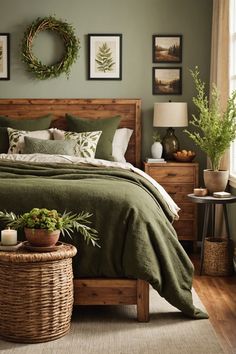 a bed with green sheets and pillows in a bedroom next to a basket full of plants