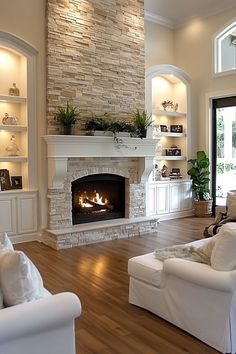 a living room filled with furniture and a fire place in the middle of a room