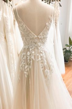 wedding gowns on display in a bridal shop