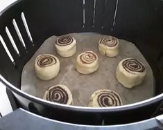 some food is being cooked in a pot on the stove and ready to be put into the oven