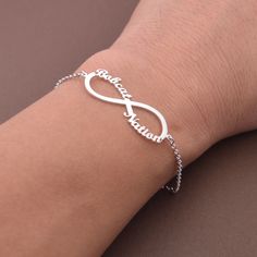 This Personalized Infinity Name Bracelet is one of the most special and personal pieces of jewelry you can own or give as a gift. This Infinity Name Bracelet is made of solid sterling silver. All items are nicely packaged ready to gift in elegant jewelry boxes. Product Description Pendant&Chain:Sterling Silver Color: silver, gold,rose gold,white gold Nameplate Width: 20-30 mm (according to the length of the names,its size is not fixed) Thickness : 1.2 mm. (approx.) ###How to order### Please choo Trendy Silver Jewelry, Infinity Bracelets, Silver Infinity Bracelets, Rose Gold White, Name Bracelet, Cute Rings, Bracelet Argent, Jewelry Boxes, Custom Necklace