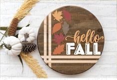 a wooden sign that says hello fall on it