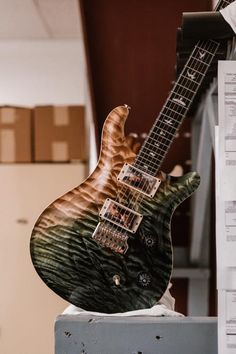 an electric guitar sitting on top of a table