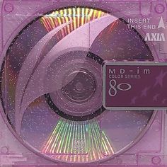 the cd is in its plastic case with pink and purple designs on it's side