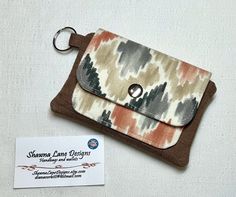 "This women's mini /small wallet makes the perfect affordable gift!  Made from canvas fabric, the cash/coin purse that you see in the first few pictures is ready to ship! What you see is what you will get!  This mini wallet is great for running errands or for a night out, you can easily clip your keys to it, add a bit of cash, your ID, a few cards, and still have room for some extra essentials. (The last few photos are sample pictures) Approx. size is 5 1/2\" wide X  4 \" tall when closed.  Features:  -Slip pocket for ID and credit cards - Secure zipper compartment for coins, etc.  - Second slip pocket behind the zipper compartment for extras like a make-up compact, or a tube of    lipstick. - Nickel finish metal snap closure.  - Metal/ easy open key ring  - Made from cotton canvas materia Credit Card Pouch, Pouch Keychain, Minimalist Handbag, Fabric Wallet, Card Pouch, Keychain Wallet, Wallet Organization, Vinyl Fabric, Affordable Gifts