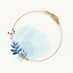 a circular frame with blue leaves and gold glitter