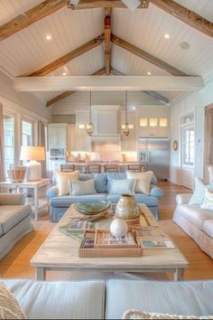 a living room filled with furniture and lots of windows