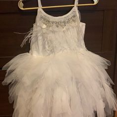 White Embellished Feather Dress Size 4 New With Tags Elegant Embellished Tutu Dress For Dress-up, Elegant Feather Trim Dress For Pageant, White Sleeveless Princess Dress For Holidays, Spring Feather Trim Dress For Dress-up, Elegant Feather Trim Dresses For Dress-up, Elegant Dress With Feather Trim For Dress-up, Spring Feather Trim Dress, White Tutu Dress For Wedding And Holiday, White Holiday Wedding Tutu Dress