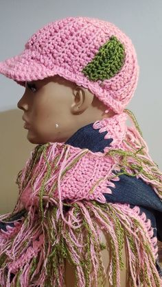 a mannequin wearing a pink hat and scarf