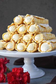 a white plate topped with cookies covered in frosting