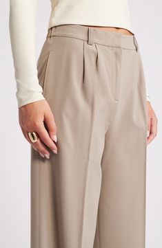 Move from desk days to drinks dates in gracefully draped pants cut from a feel-good fabric. 30" inseam; 24" leg opening; 13" front rise; 16 1/2" back rise (size 8) Zip fly with hook-and-bar closure 62% REPREVE® recycled polyester, 33% rayon, 5% spandex REPREVE recycled polyester is made from 100% post-consumer recycled plastic bottles Machine wash, tumble dry Imported Spring Wide-leg Tapered Pants, Elegant Tapered Pants For Fall, Elegant Tapered Fall Pants, Beige Tapered Leg Dress Pants, Beige Tapered Pants, Tapered Beige Pants, Elegant Wide Leg Tapered Pants, Elegant Tapered Wide Leg Pants, Elegant Tapered Wide-leg Pants