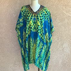 Beach Cover-Up Kaftan By Jovie Green Blue Pockets One Size Nwt Brand New Cover Up Or Can Be Used As A Kaftan Mumu With A Peacock Design All Over. Best Of All Has Pockets. Measurement 38"X 22" Blue Printed V-neck Cover-up, Tropical Blue Kaftan For Beach Cover-up, Blue Summer Kaftan For Pool, Blue Printed Kaftan For The Beach, Turquoise Kaftan For Beach, Blue Printed Resort Cover-up, Blue Printed Cover-up For Resort, Blue One Size Cover-up For Vacation, Blue Beachwear Kaftan For Pool