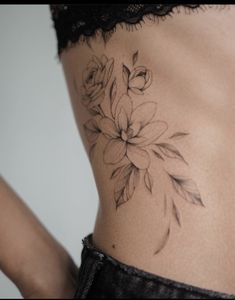 a woman's stomach with flowers on it