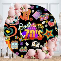 balloons and streamers are in front of a backdrop with the words back to the 70's