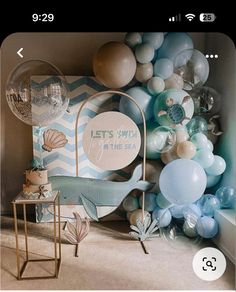 a room with balloons and decorations on the wall