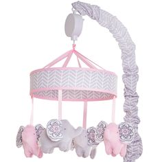 a pink and white baby crib mobile with elephants hanging from it's sides