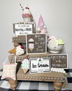 a table topped with lots of different types of ice cream and desserts on top of it