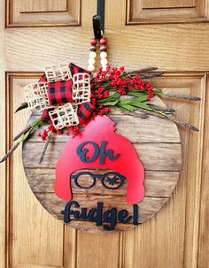 a door hanger that says oh fudgel with a fireman's hat and glasses on it