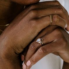 a close up of a person wearing a ring