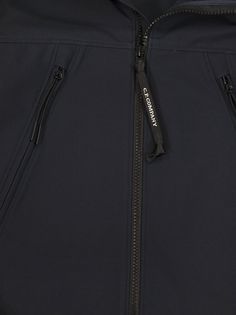 Medium jacket from the Undersixteen line with Goggle hood and full zip fastening. It is made of recycled nylon stretch softshell fabric and features two diagonal zipped pockets on the front, an elastic hem and ribbed cuffs. C. P. Shell-R, a C. P. Company proprietary softshell fabric, is made using recycled nylon yarns. The properties that distinguish the standard C. P. Shell fabric remain unchanged. - Recycled fabric - Goggle hood - Full zip closure - Diagonal zipped pockets - Elasticated hem - Ribbed cuffs DESIGNER ID: 14CKOW001B005968A 888Composition: 92% Polyester, 8% Elastane Sporty Hooded Jacket For Outdoor, Functional Hooded Jacket With Zip Fly For Outdoor, Outdoor Functional Hooded Jacket With Zip Closure, Functional Outdoor Hooded Jacket With Zip Fly, Luxury Nylon Windbreaker With Double-lined Hood, Utility Nylon Windbreaker With Double-lined Hood, Windproof Gore-tex Functional Outerwear, Gore-tex Hooded Windproof Windbreaker, Softshell Fabric