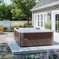 a hot tub sitting on top of a wooden deck