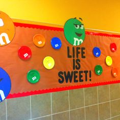 the bulletin board is decorated with colorful magnets on it's sides and words that spell out life is sweet