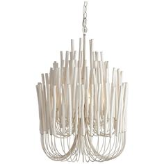 a white chandelier hanging from the ceiling with lots of sticks attached to it