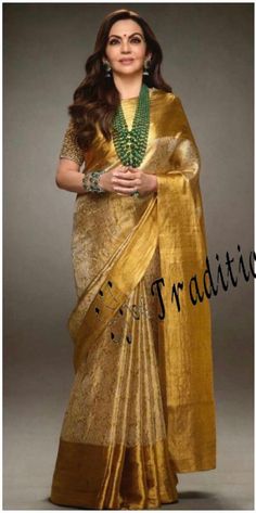 🥰 This Beautiful Banarasi Tissue Nita Ambani Saree have following details 🥰 🔥 Product Detail: 👉🏻 Design Details: Banarasi Tissue Nita Ambani Saree With Blouse Piece. 👉🏻 Size & Fit: Length: 5.5 meters plus 0.8 Meter blouse piece Width: 1.06 meters (approx) Saree Weight : 0.650 gms 👉🏻 Material and care: Saree Type : Banarasi Saree Fabric: Tissue  Blouse Fabric: Tissue Blouse Type: (Without Stitch and Stitch) Dry-clean first time there after machine wash or hand wash. 👉🏻Shipping:- We shi Nita Ambani Blouse Designs, Transitional Katan Silk Pre-draped Saree For Wedding, Transitional Gold Banarasi Silk Pre-draped Saree, Gold Slub Silk Kurta For Transitional Season, Gold Slub Silk Pre-draped Saree For Festivals, Traditional Gold Pre-draped Saree For Navratri, Transitional Gold Slub Silk Kurta, Elegant Wedding Blouse With Zari Weaving, Elegant Gold Pre-draped Saree For Transitional Season