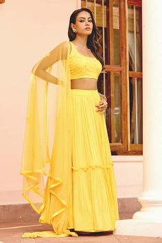 Yellow attached cancan lehenga with layered ruffle pleated detailing. Paired with mirror, thread, sequin work padded blouse and border embroidered sheer dupatta. - Aza Fashions Bollywood Style Georgette Tiered Sharara, Bollywood Style Georgette Sharara With Tiered Skirt, Tiered Ruffle Georgette Lehenga, Anarkali Sets With Ruffles In Georgette, Bollywood Georgette Sets With Tiered Skirt, Georgette Sets With Ruffles And Tiered Skirt, Bollywood Style Palazzo Set With Ruffles In Georgette, Floor-length Ruffled Georgette Lehenga, Diwali Ruffled Tiered Skirt Set