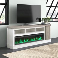 This TV stand with an electric fireplace brings warmth and entertainment to your living room or den. Made from engineered wood, it features a layered look with a darker rustic finish on the top and side, while a lighter tone on the shelves and plinth base leans into its farmhouse vibe. Interior shelves store your media components, CDs, DVDs, and gaming equipment. The side cabinet provides extra storage space. We love that the electric fireplace emits heat and has adjustable flames for a cozy atm Farmhouse Entertainment Center, Fireplace Tv Stand, Side Cabinet, Living Room White, Extra Storage Space, Electric Fireplace, Entertainment Center, Tv Stand, Engineered Wood