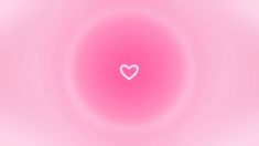 a pink background with a white heart in the center