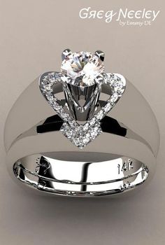 a white gold ring with a heart shaped diamond