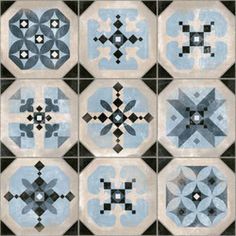 nine blue and black tile designs on the floor in different shapes, sizes and colors