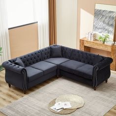 a living room with a sectional couch and rug