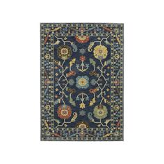 a blue rug with an ornate design on the bottom and sides, in different colors