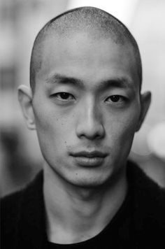 a black and white photo of a man's head with an odd look on his face