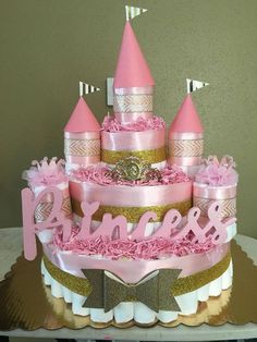 a pink and gold birthday cake that says princess on it's tiered tower