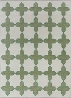 a green and white rug with an intricate design on the bottom, in different sizes