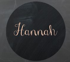 the word hannah written in cursive writing on a black circle with pink lettering