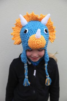 This triceratops dinosaur hat makes the perfect gift for any Dino loving fan. It can be made in a variety of colours as it is made to order so just message me to ask.  Made using acrylic yarn it is both warm and also washable. Bear Hat Pattern, Crochet Bear Hat, Crochet Santa Hat, Crochet Animal Hats, Dinosaur Hat, Crochet Santa, Lion Brand Wool Ease, Crochet Dinosaur, Bonnet Crochet