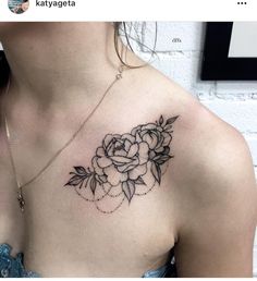 a woman with a flower tattoo on her chest