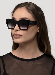 SQUARED THICK ANGLED CATEYE SUNGLASSES IN BLACK PRODUCT DETAILS Bio Acetate Material Frame: Squared Cateye Color: Black Lens: Gradient Smoke #CAT3 100% UV Protection Comes with a Soft Cream Vegan Case SIZE CM INCHES FRAME WIDTH 14.5 CM 5.7" FRAME HEIGHT 5.4 CM 2.1" LENS WIDTH 5.3 CM 2" LENS HEIGHT 4.1 CM 1.6" Black Rectangular Cat Eye Sunglasses With Gradient Lenses, Black Square Sunglasses With Gradient Lenses, Chic Square Sunglasses For Party, Black Square Sunglasses For Parties, Black Square Sunglasses For Party, Chic Black Square Sunglasses, Black Square Frame Cat Eye Sunglasses With Gradient Lenses, Black Cat Eye Sunglasses With Gradient Square Frame, Edgy Black Sunglasses With Gradient Lenses