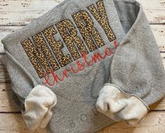 Leopard Merry Christmas Sweatshirt, Christmas Sweatshirt, Cheetah Sweatshirt, Christmas Sweatshirt, Christmas Gift  Please Check All Photos for Details  Nothing speaks more festive for the holidays than this comfy sport grey unisex Merry Christmas sweatshirt. Design: Appliqué and Thread on Sport Grey Crew/Sweatshirt  MERRY is with animal print fabric Christmas is with red thread  Brand: Pre-Shrunk Adult Unisex Heavy Blend™ Adult 8 oz., 50/50 Fleece Crew  CARE INSTRUCTIONS  * Wash item inside out in cold water * Lay flat to dry * Do not bleach * Do not iron directly onto the design * Do not dry clean  PRODUCTION AND SHIPPING  * Processing time is 5-7 business days. Does not include shipping time.   RETURN & CANCELLATIONS  * Due to the nature of this being a made to order item we cannot acce Gray Winter Loungewear T-shirt, Warm Gray Loungewear T-shirt, Cheetah Sweatshirt, Merry Christmas Design, Leopard Christmas, Animal Print Fabric, Red Thread, Sweatshirt Christmas, Crew Sweatshirts