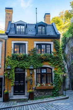 an old brick building with ivy growing on it