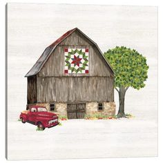 an old red truck is parked in front of a barn with a quilt on it