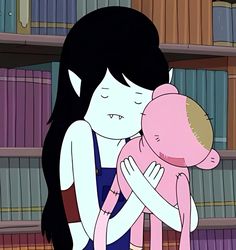 a woman hugging a pink teddy bear in front of a book shelf filled with books