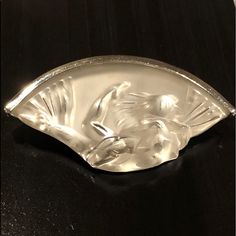 a glass bowl with a dog on it