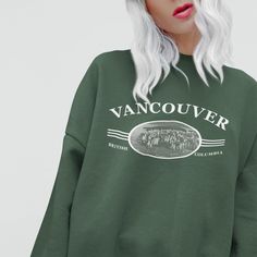 Retro Vancouver print on a comfy, relaxed fit crewneck sweatshirt. Inspired by classic vintage designs. Perfect for any occasion or as a gift for him or her. This is your new go-to favourite sweatshirt for outdoor hangouts, hiking trips, or apres ski! Also great for celebrating Canada Day. A pre-shrunk, classic fit sweater that's made with air-jet spun yarn for a soft feel and reduced pilling.  Crewneck Sweatshirt - Unisex Sizing - Same sizing as a Men's standard sweatshirt - 50% cotton, 50% pol Vintage Crew Sweatshirt With Lettering, Retro Crew Neck Hoodie For Fall, Oversized Retro Hoodie With Crew Neck, Relaxed Fit Crew Sweater With Lettering, Vintage Letter Print Relaxed Fit Sweatshirt, Vintage Crew Neck Sweatshirt With Lettering, Relaxed Fit Crewneck Sweater With Lettering, Vintage Long Sleeve Sweatshirt With Letter Print, Retro Crew Neck Sweater With Letter Print